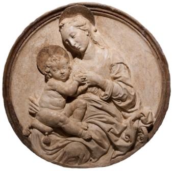 Si tratta di un altorilevo raffigurante una Madonna del Latte, che replica e riproduce il tondo in marmo inserito nella lunetta del sepolcro Tartagni, monumento funebre realizzato in marmo nella basilica di San Domenico dallo scultore fiesolano Francesco di Simone Ferrucci (1437-1493) per il giurista imolese e dottore dello Studio bolognese Alessandro Tartagni, morto nel 1477